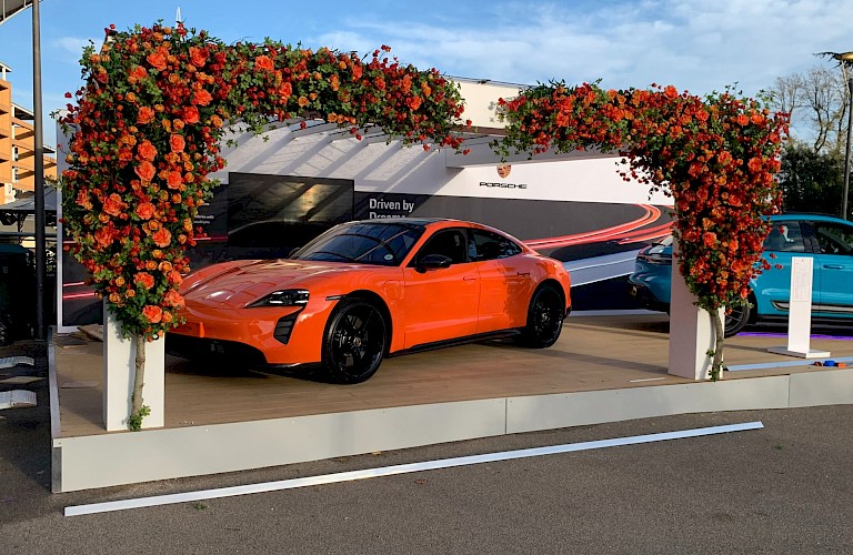 Bespoke artificial installation for Porsche - Artificial orange roses and physalis mixed with artificial and living greenery to create a vibrant display for Porsche